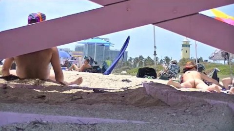 Exhibitionist Wife 63 - Tatiana teasing NUDE BEACH VOYEUR cocks while her hubby takes a nap!