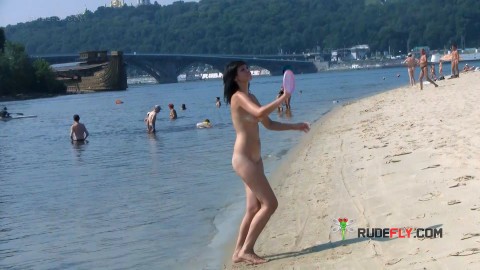 Bombastic young nudist babes sunbathe nude at the beach